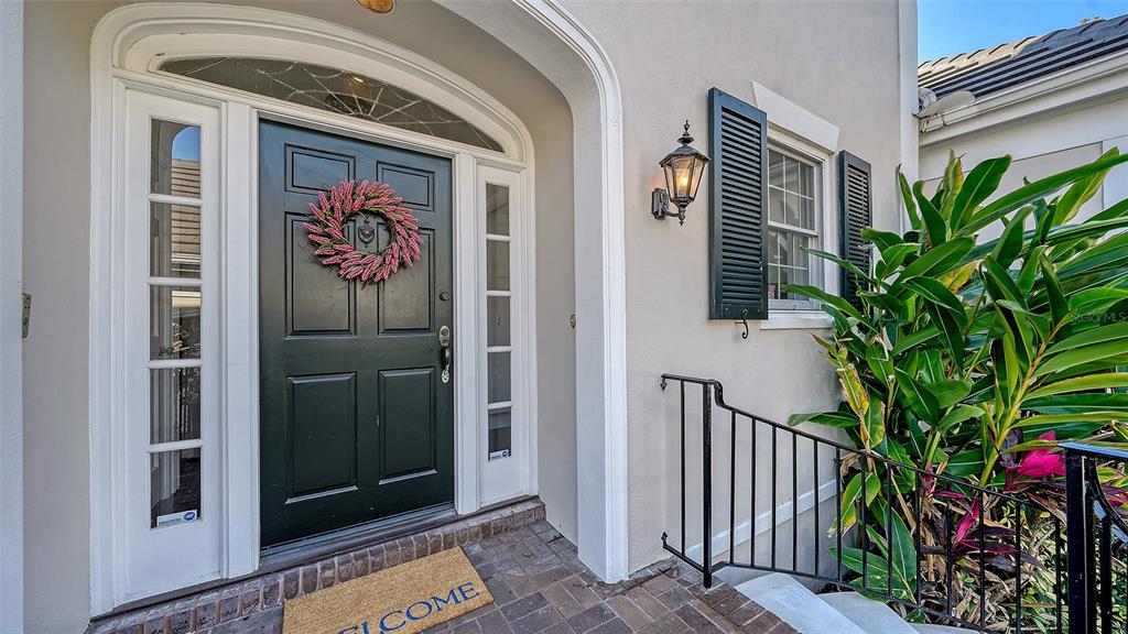 57 Bishopscourt Road, Unit 121 Osprey, FL 34229 - Photo 5 of 86 a view of an entryway with a flower pot