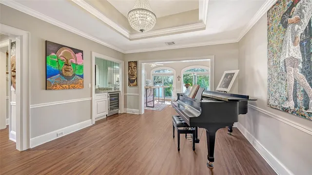 a view of a dining room with furniture and wooden floor
