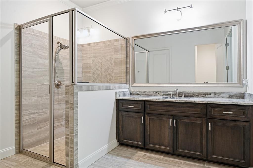 337 Rosshandler Road Suwanee, GA 30024 - Photo 33 of 45 a bathroom with a sink and a mirror
