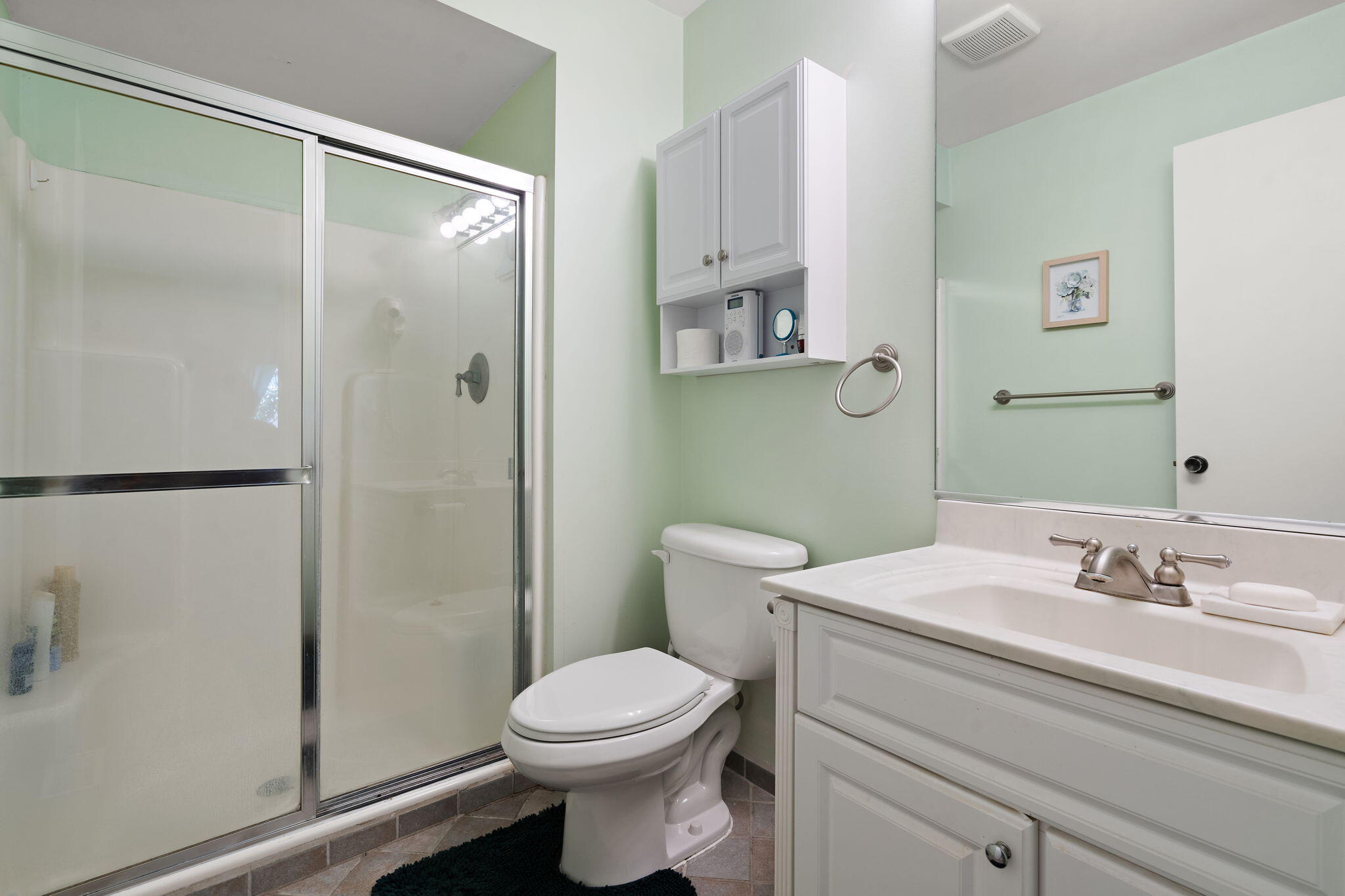 5015 Spinnaker Lane, Unit C Crown Point, IN 46307 - Photo 11 of 24 a bathroom with a sink toilet and shower