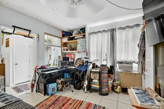 a bedroom with a bed and a table