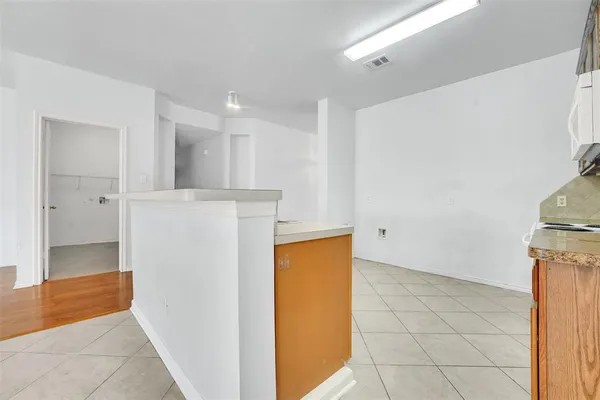 a kitchen with stainless steel appliances granite countertop a stove a sink dishwasher and a refrigerator