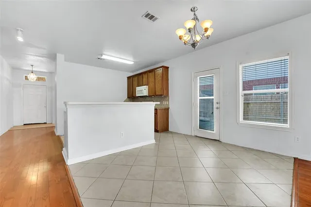 a view of a storage & utility room with two washing machine