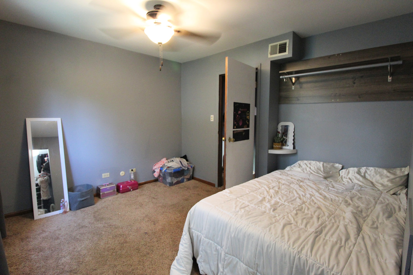 32 Emery Drive Bourbonnais, IL 60914 - Photo 13 of 17 a bedroom with a bed and a chandelier