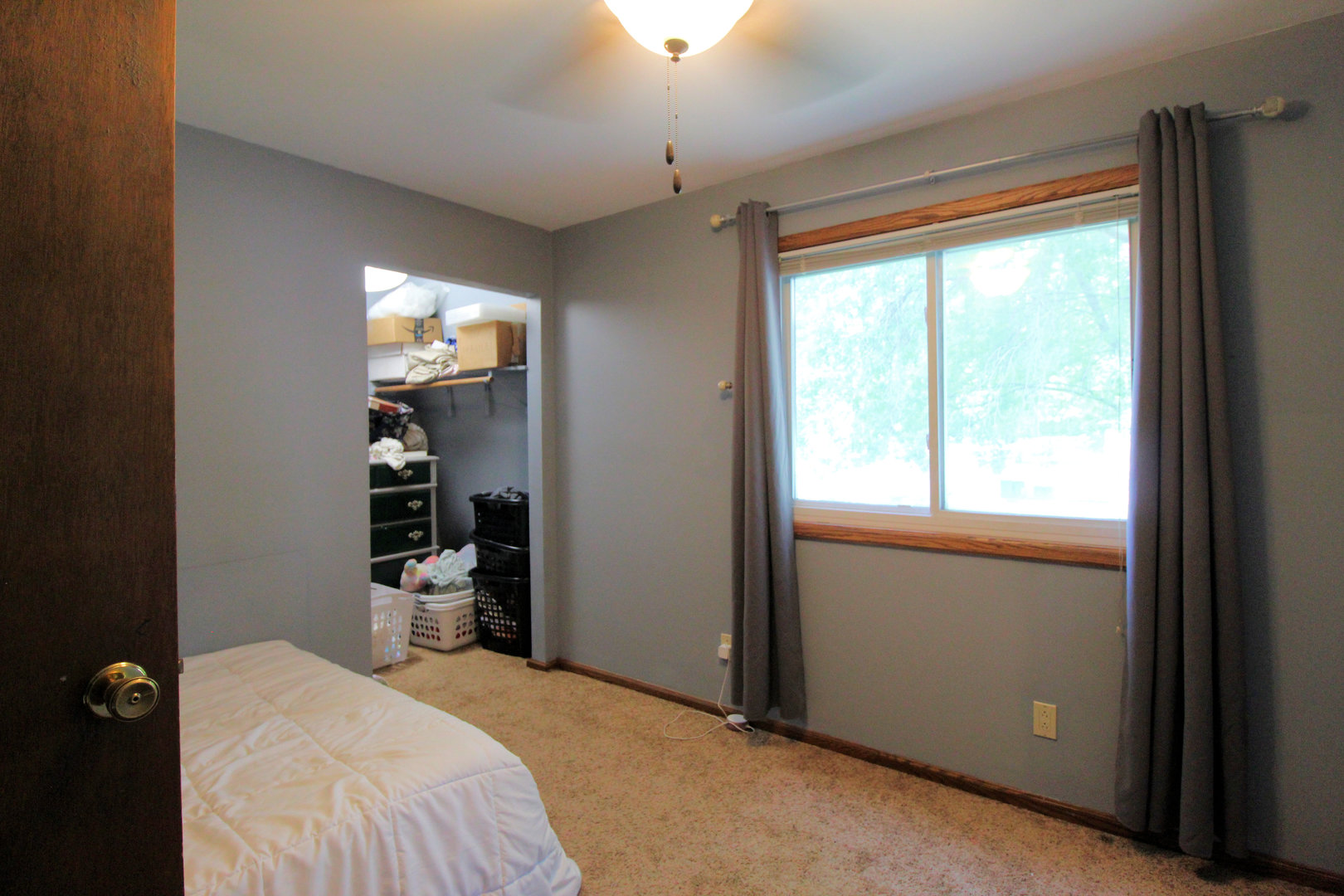 32 Emery Drive Bourbonnais, IL 60914 - Photo 14 of 17 a bedroom with a bed and a flat tv screen on dresser