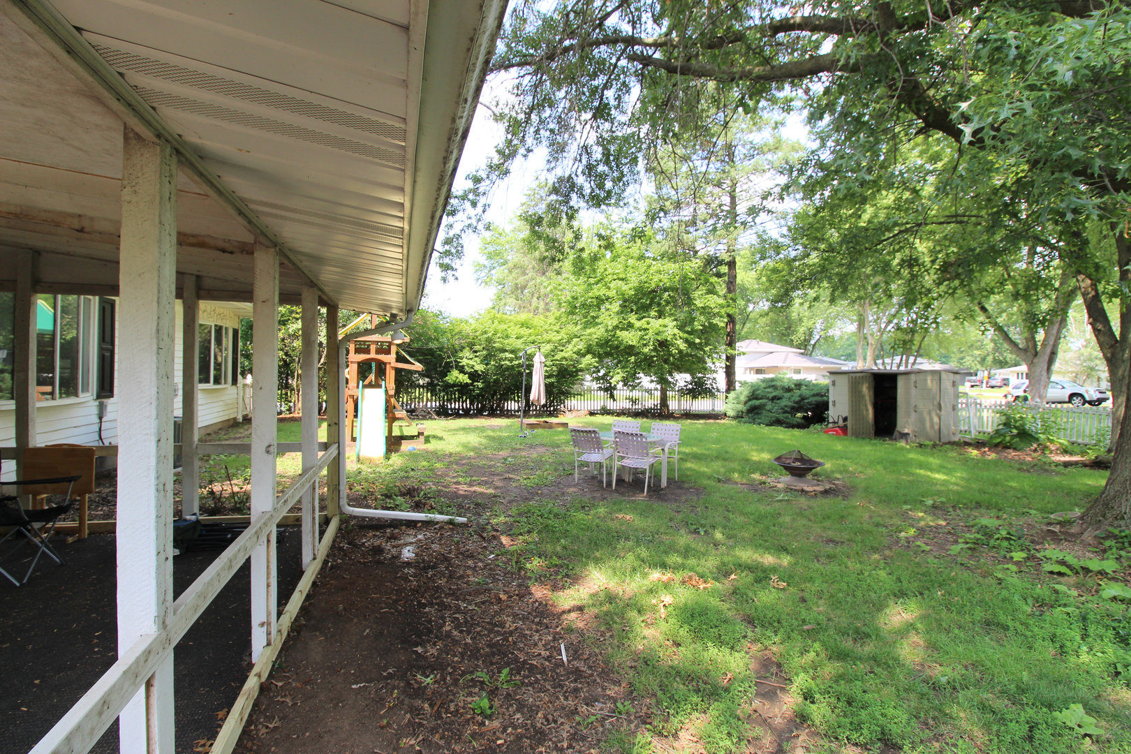 32 Emery Drive Bourbonnais, IL 60914 - Photo 17 of 17 a backyard of a house with table and chairs