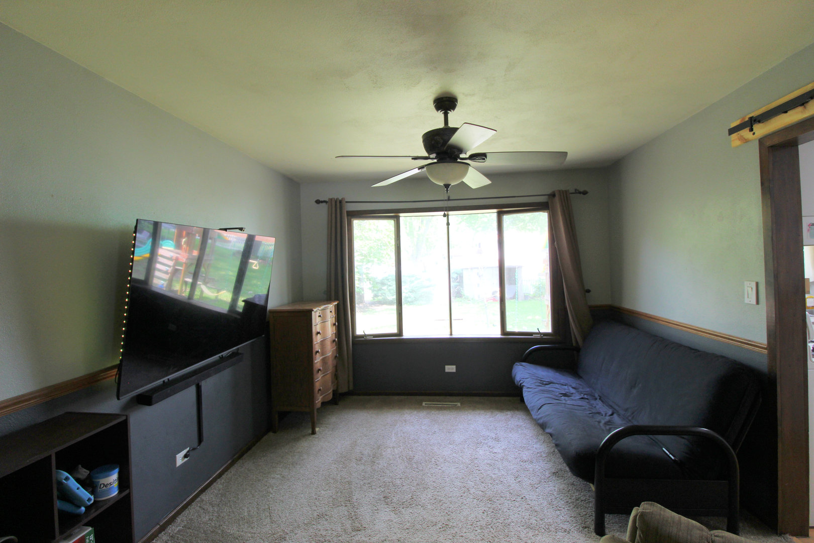 32 Emery Drive Bourbonnais, IL 60914 - Photo 5 of 17 a living room with furniture and a flat screen tv