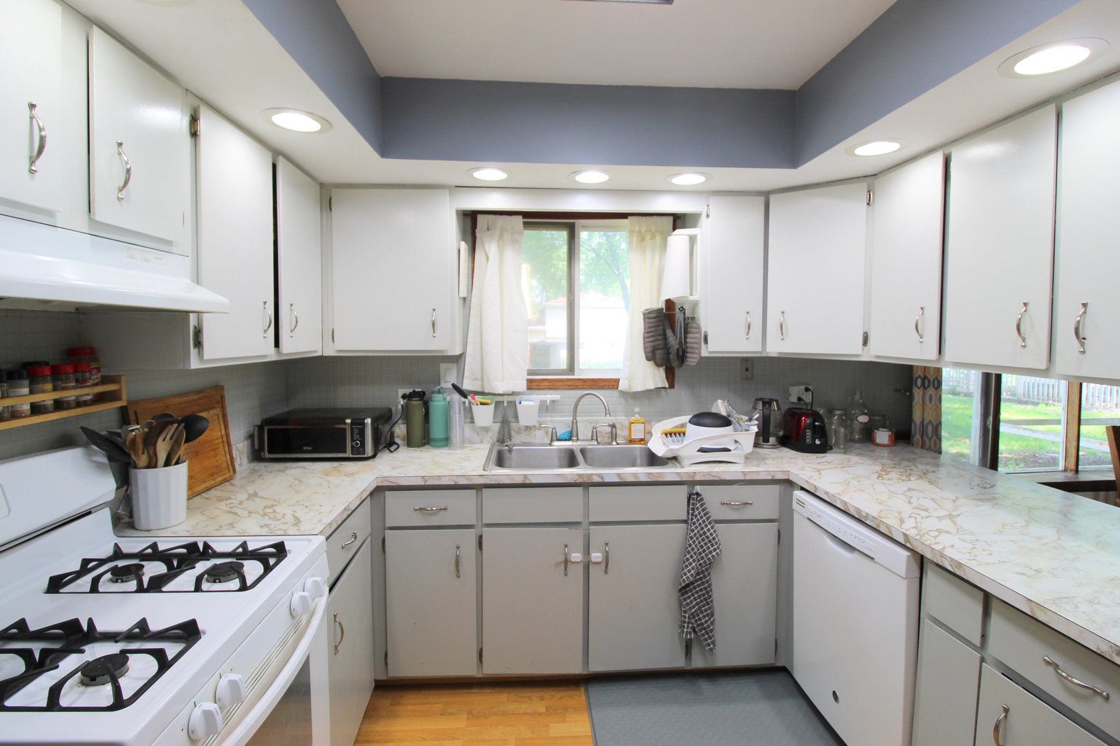 32 Emery Drive Bourbonnais, IL 60914 - Photo 7 of 17 a kitchen with a sink a stove and cabinets