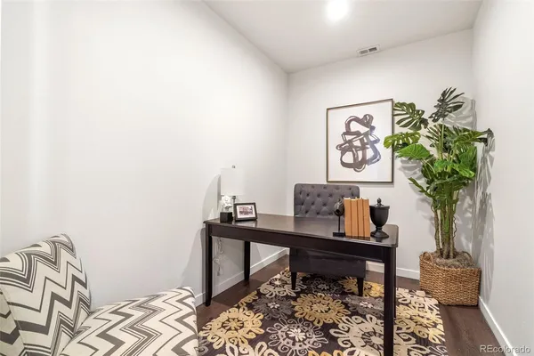 a view of a workspace with furniture