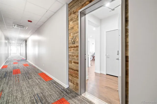 a very nice looking hallway with a wooden floor