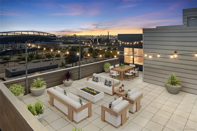 a view of a terrace with furniture and potted plants