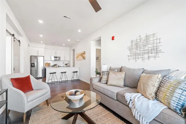 a living room with furniture and a table