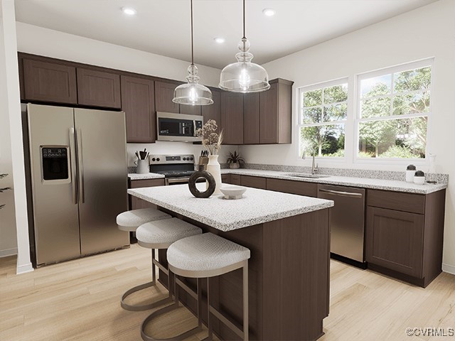 206 Greenpark Road Sandston, VA 23150 - Photo 7 of 16 a kitchen with kitchen island a sink dining table and chairs