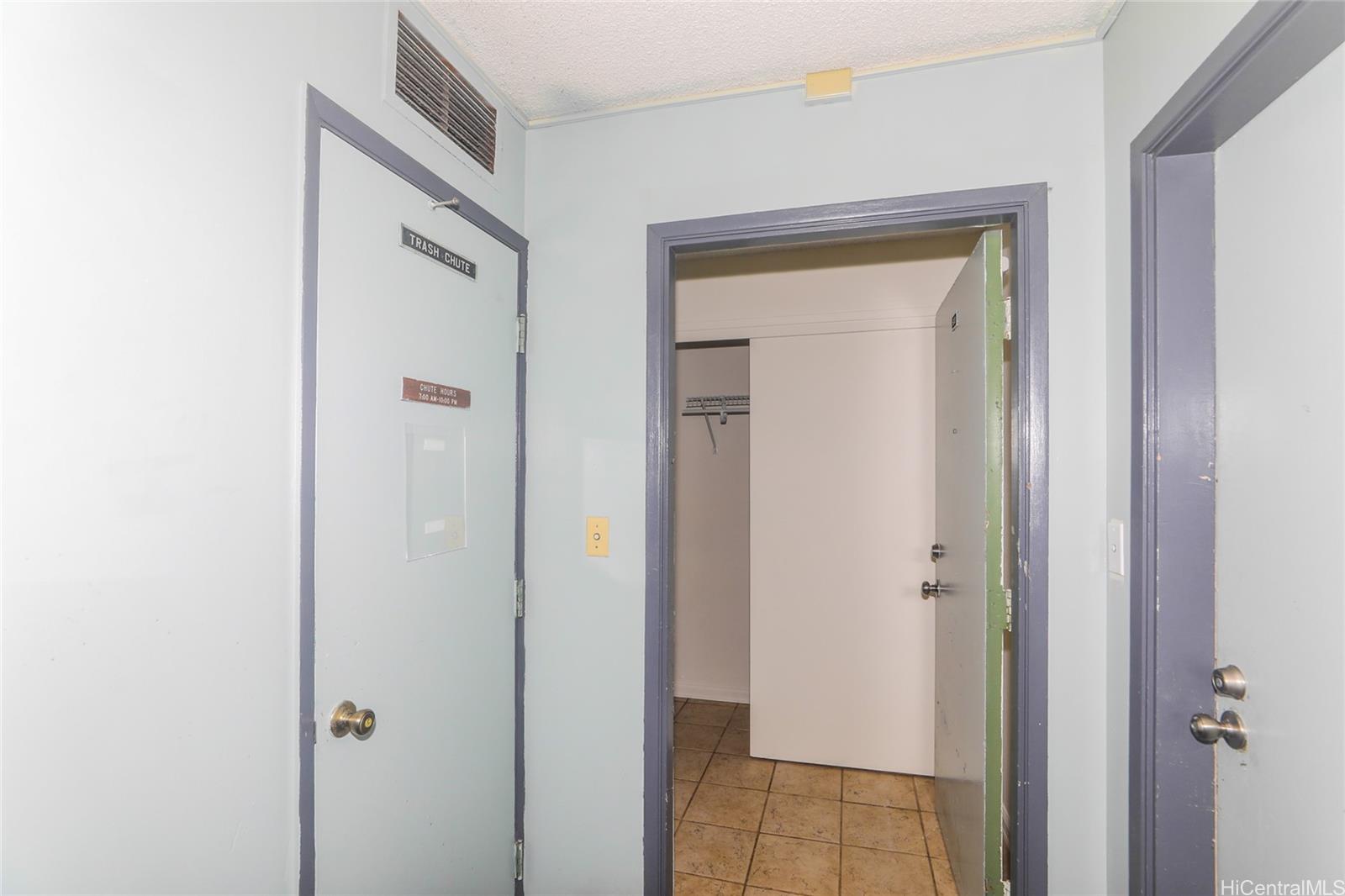 2977 Ala Ilima Street, Unit 610 Honolulu, HI 96818 - Photo 21 of 25 a view of a bathroom from a hallway