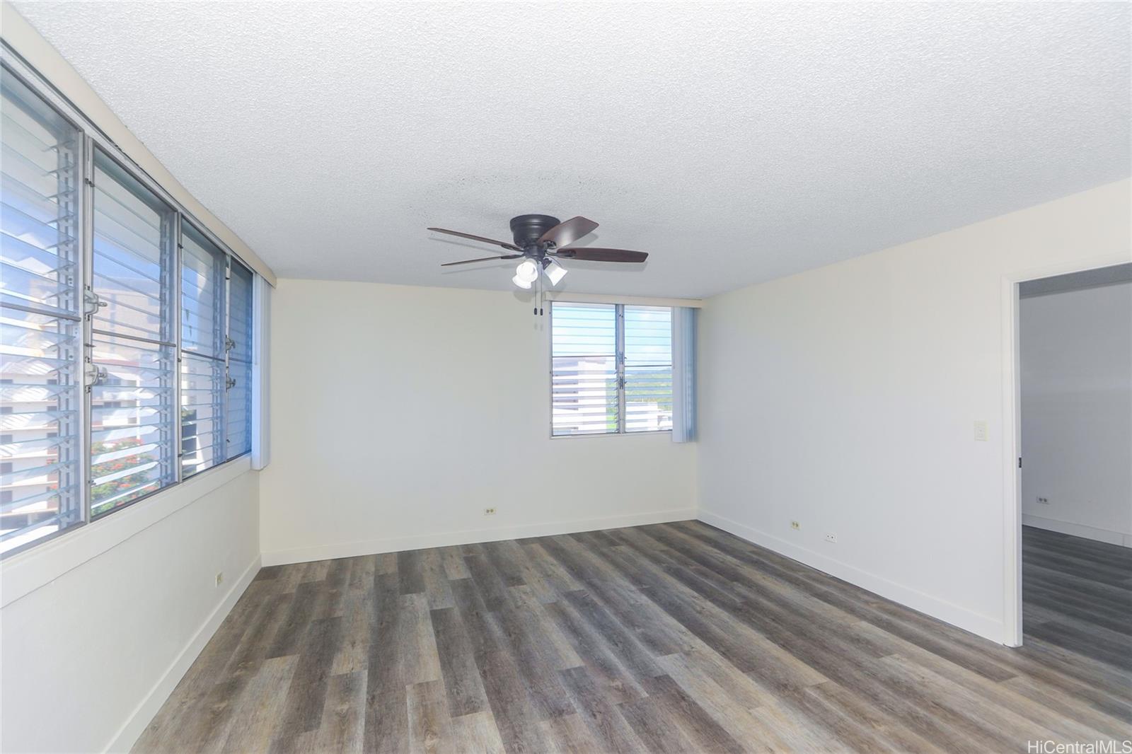 2977 Ala Ilima Street, Unit 610 Honolulu, HI 96818 - Photo 6 of 25 a view of empty room with wooden floor and fan