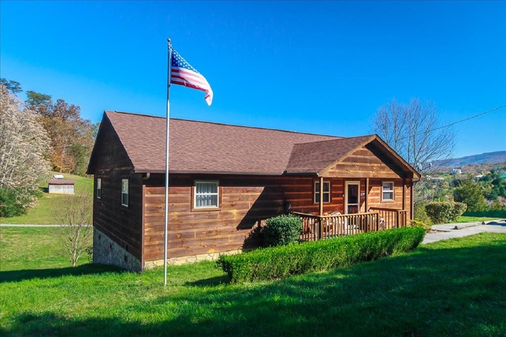 1736 Mountain Ridge Road Newport, TN 37821 - Photo 1 of 18 a front view of a house with a yard