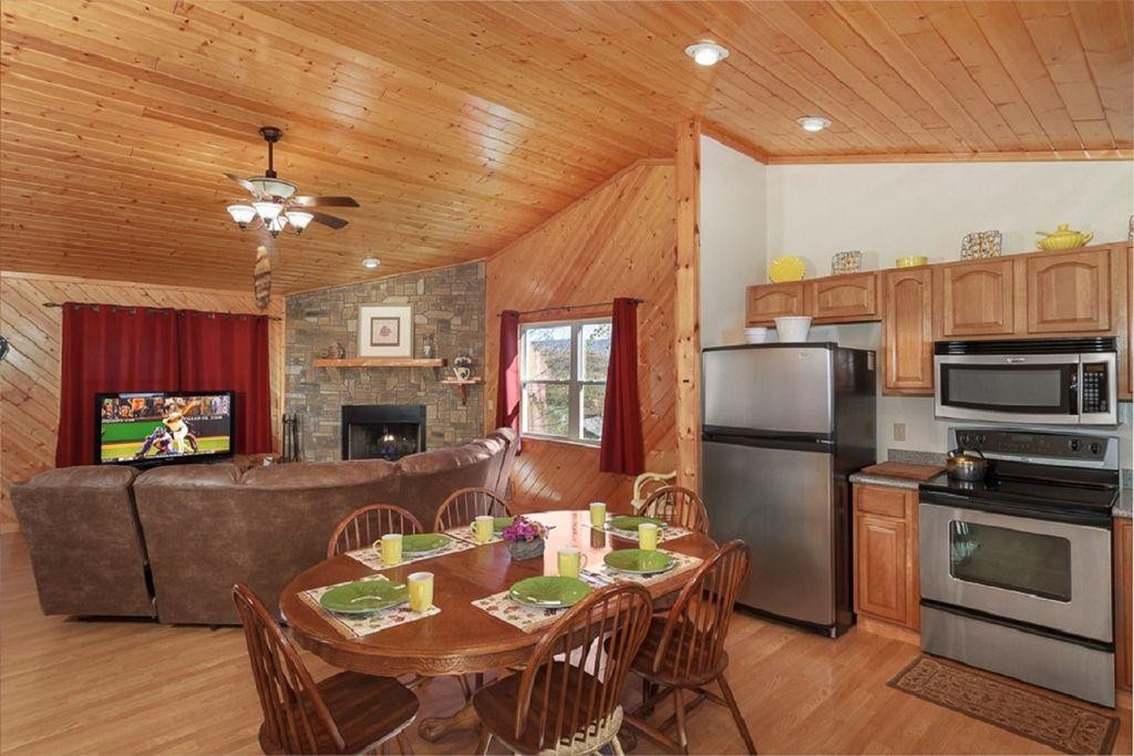 1736 Mountain Ridge Road Newport, TN 37821 - Photo 2 of 18 a living room with furniture a fireplace and a flat screen tv