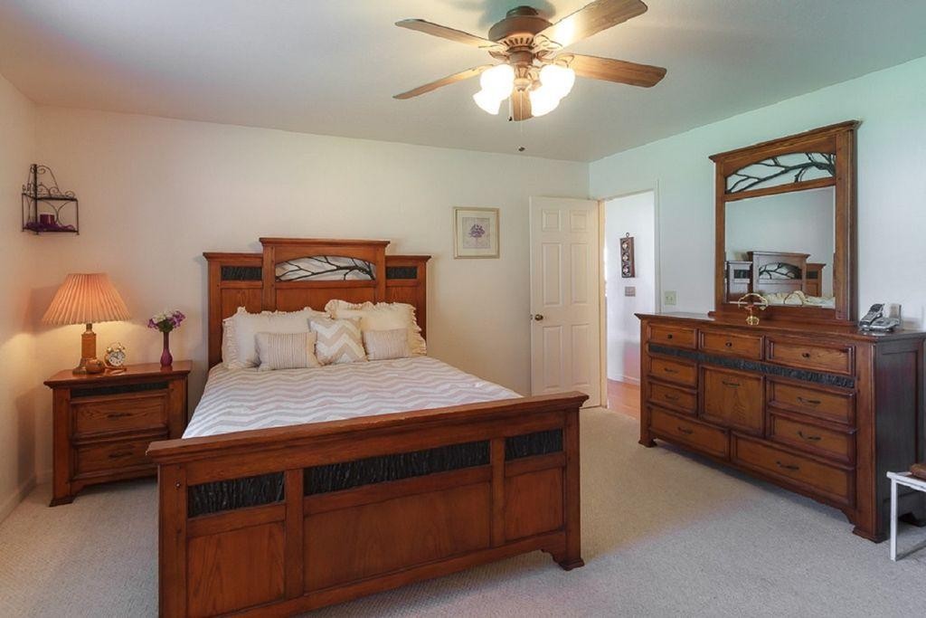 1736 Mountain Ridge Road Newport, TN 37821 - Photo 6 of 18 a bedroom with a bed and a chandelier