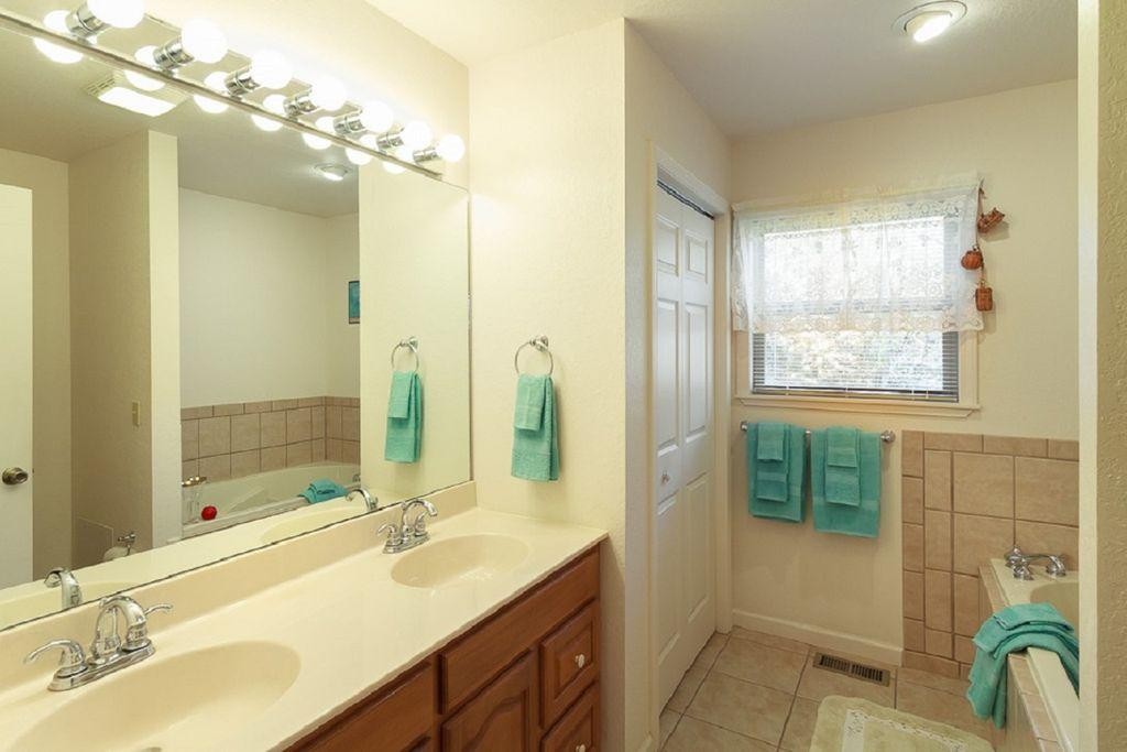 1736 Mountain Ridge Road Newport, TN 37821 - Photo 8 of 18 a bathroom with a double vanity sink mirror and shower