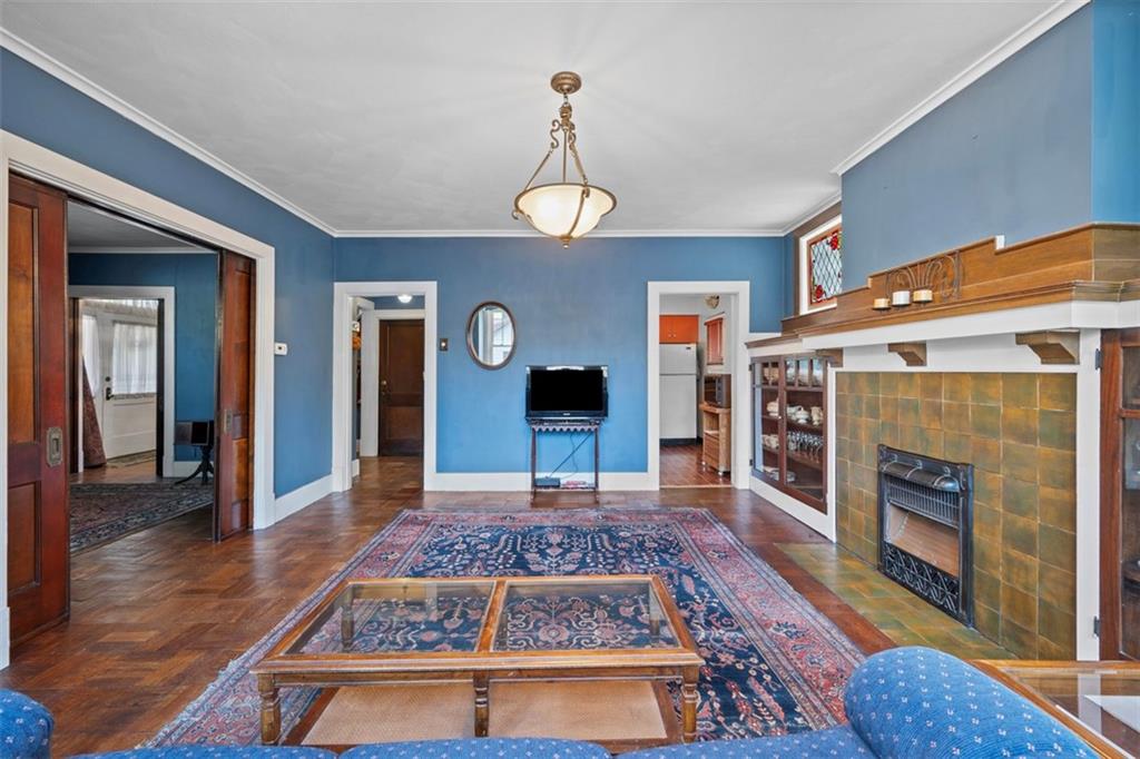 508 Cascade Road Pittsburgh, PA 15221 - Photo 16 of 46 a living room with fireplace furniture and a rug