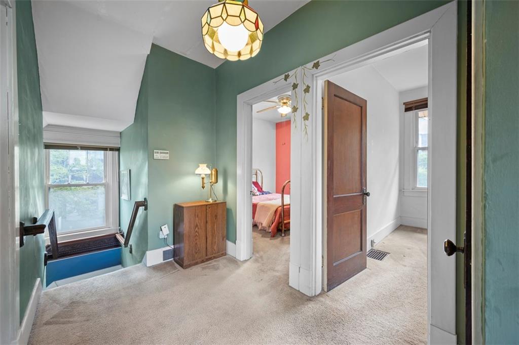508 Cascade Road Pittsburgh, PA 15221 - Photo 23 of 46 a view of a room with wooden floor and windows