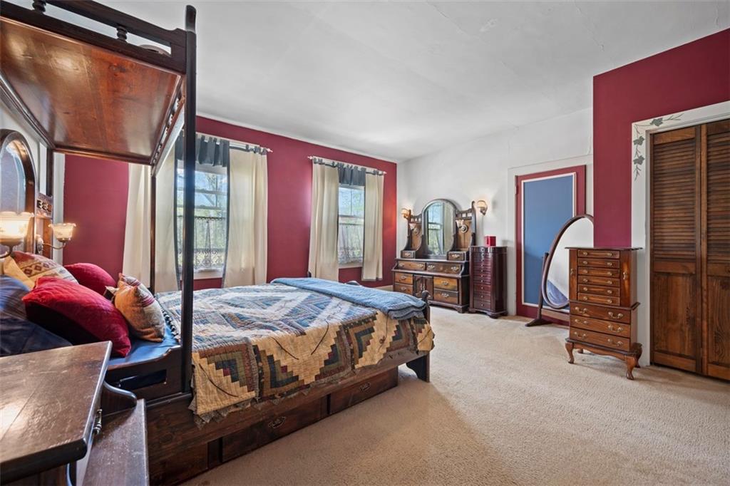 508 Cascade Road Pittsburgh, PA 15221 - Photo 30 of 46 a bed sitting in a room next to a window