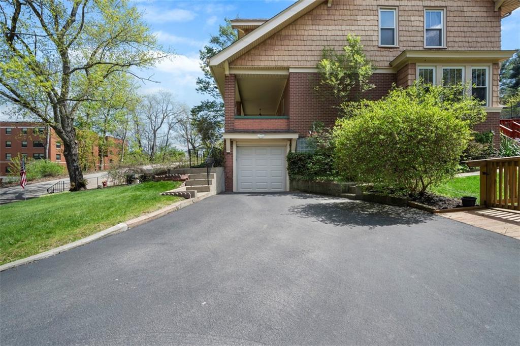 508 Cascade Road Pittsburgh, PA 15221 - Photo 34 of 46 a view of a house with a yard and large tree