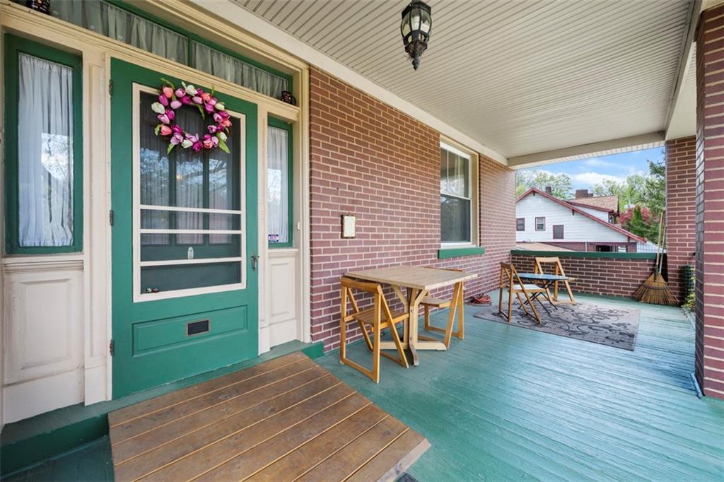 508 Cascade Road Pittsburgh, PA 15221 - Photo 4 of 46 a view of a porch with furniture and wooden floor