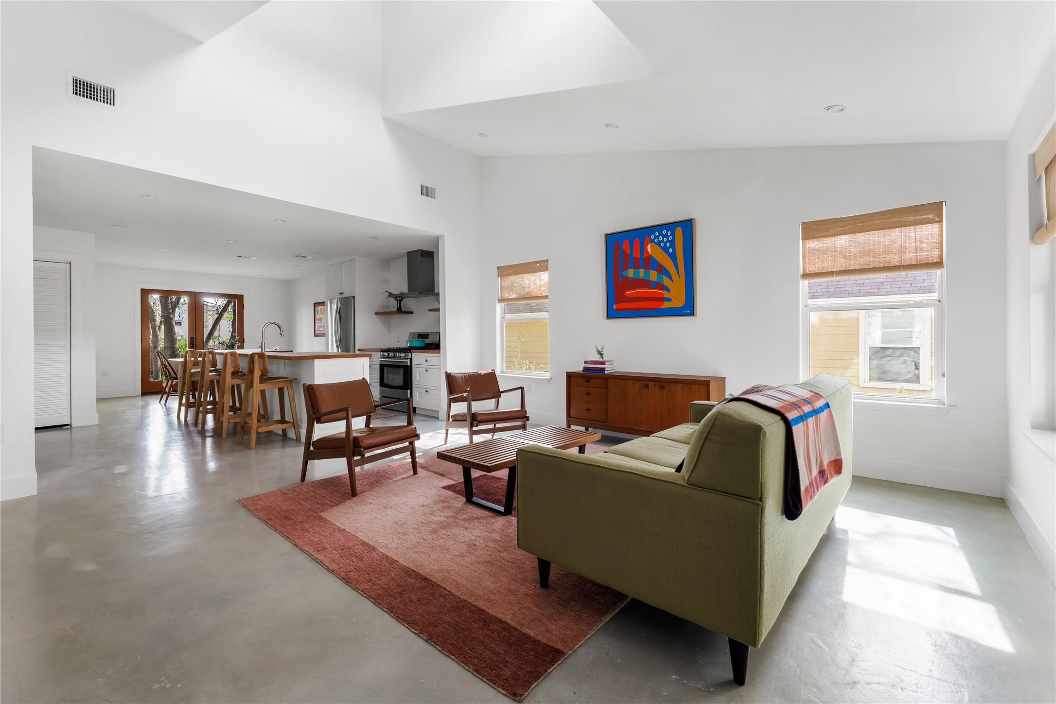 400 Delmar Avenue Austin, TX 78752 - Photo 36 of 36 An open floor plan with crisp walls and a high ceiling crowned by a dormer window creates a light-filled, airy sense of space.