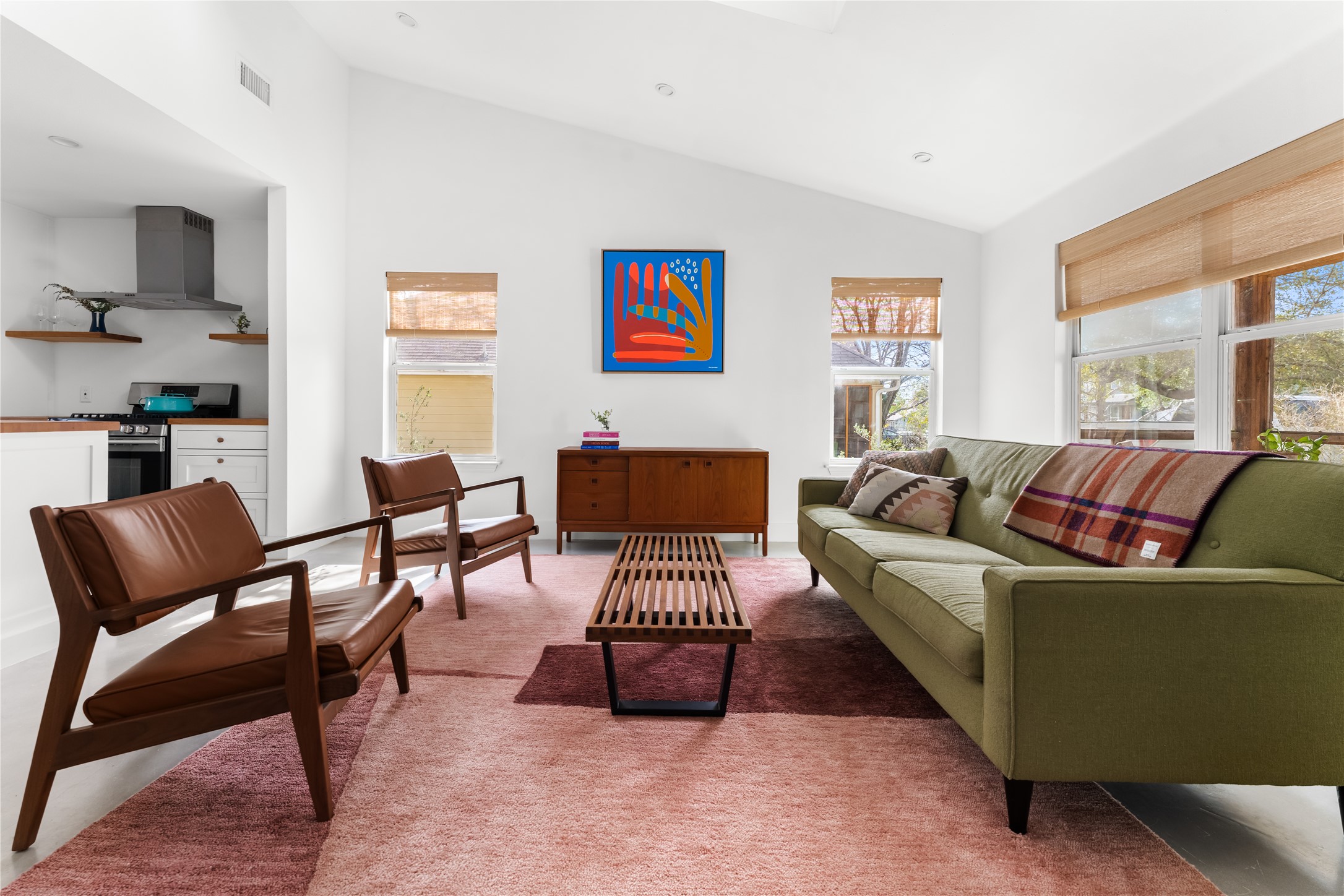 400 Delmar Avenue Austin, TX 78752 - Photo 14 of 36 The scale of the living room leaves room for multiple seating arrangements, whether centered around conversation, or media