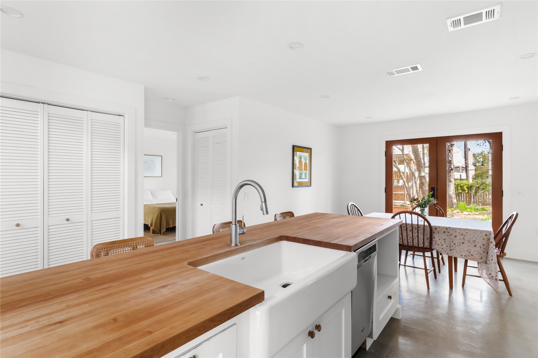 400 Delmar Avenue Austin, TX 78752 - Photo 22 of 36 The kitchen is positioned to look out toward the dining area and back deck, so there’s a natural line of sight to the outdoor space as you move through the day