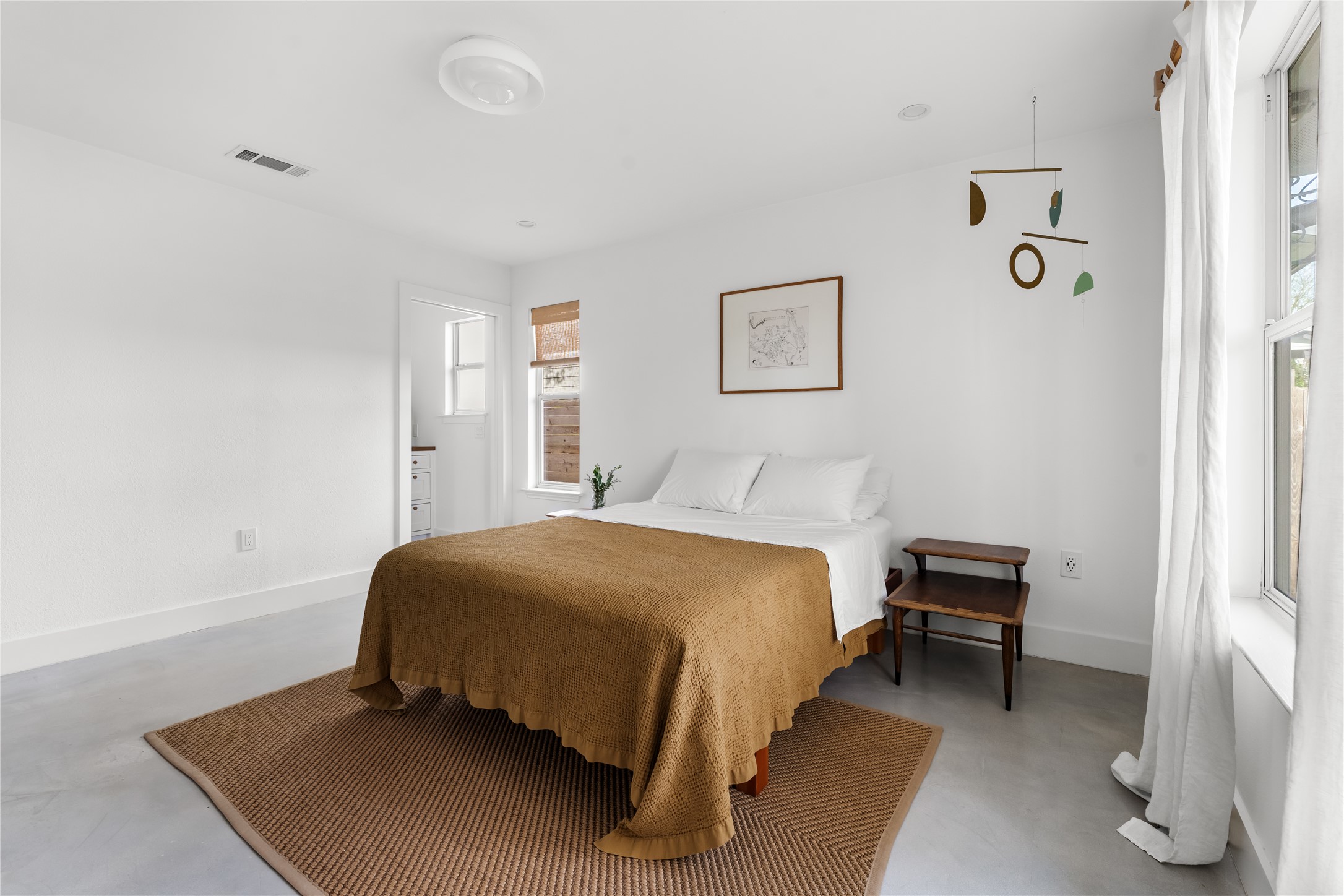 400 Delmar Avenue Austin, TX 78752 - Photo 24 of 36 Set apart from the secondary bedrooms, the primary bedroom offers a quieter layout with enough room to arrange the space in a way that fits daily routines