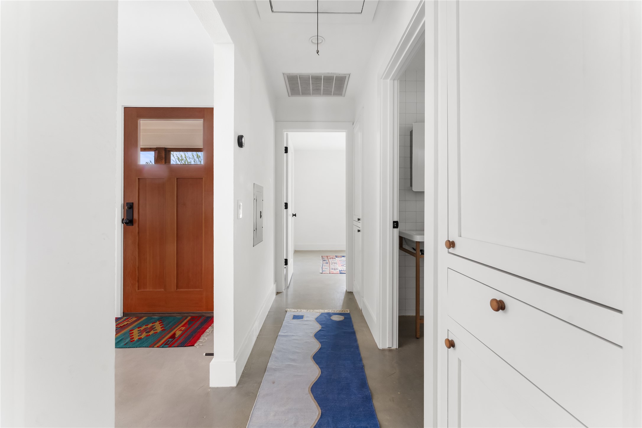 400 Delmar Avenue Austin, TX 78752 - Photo 26 of 36 The hallway includes built-in cabinetry that adds functional storage while keeping the main living areas free from clutter