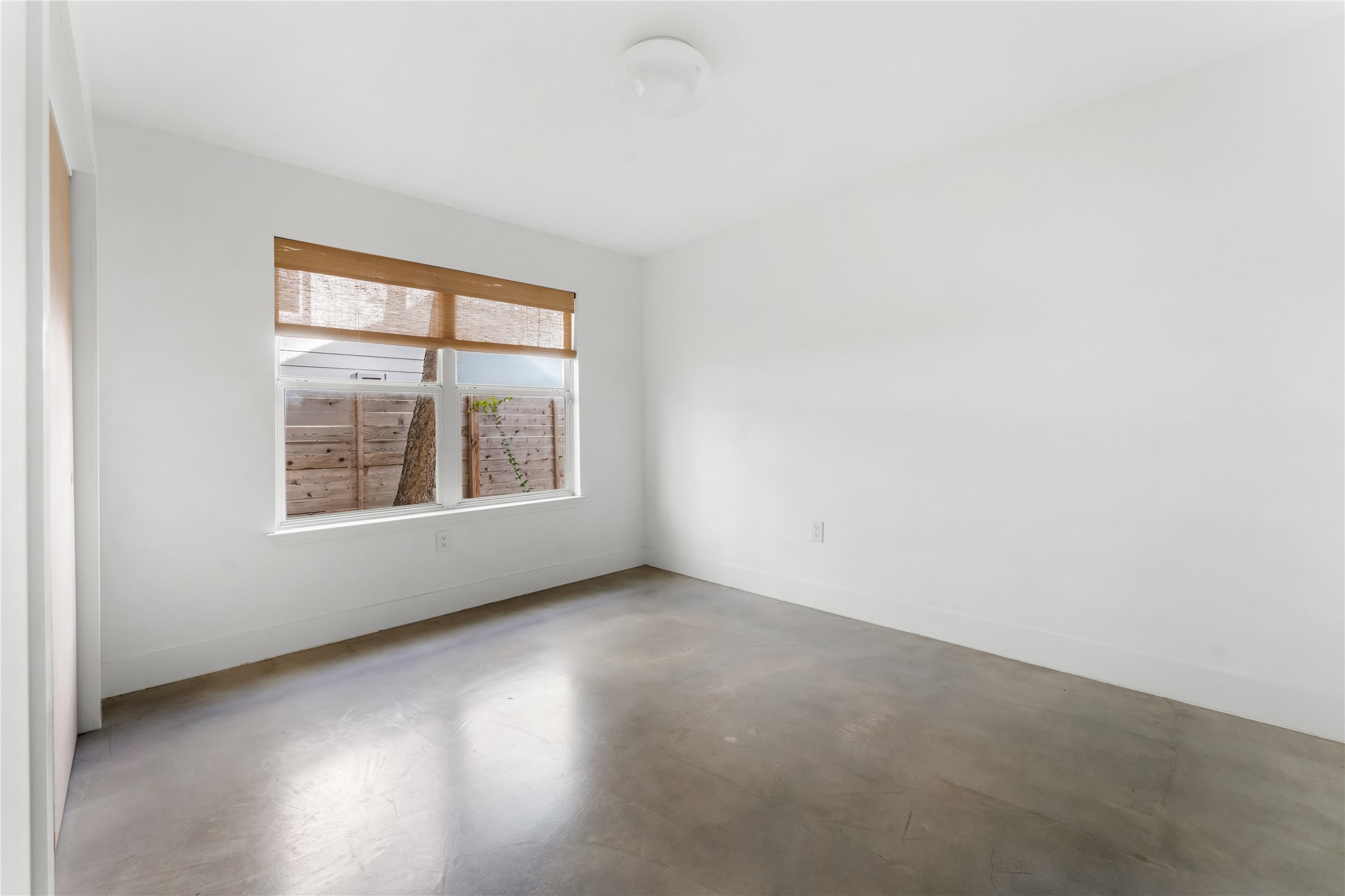400 Delmar Avenue Austin, TX 78752 - Photo 29 of 36 Each guest bedroom carries through the same natural light and neutral finishes, keeping a consistent feel throughout the home