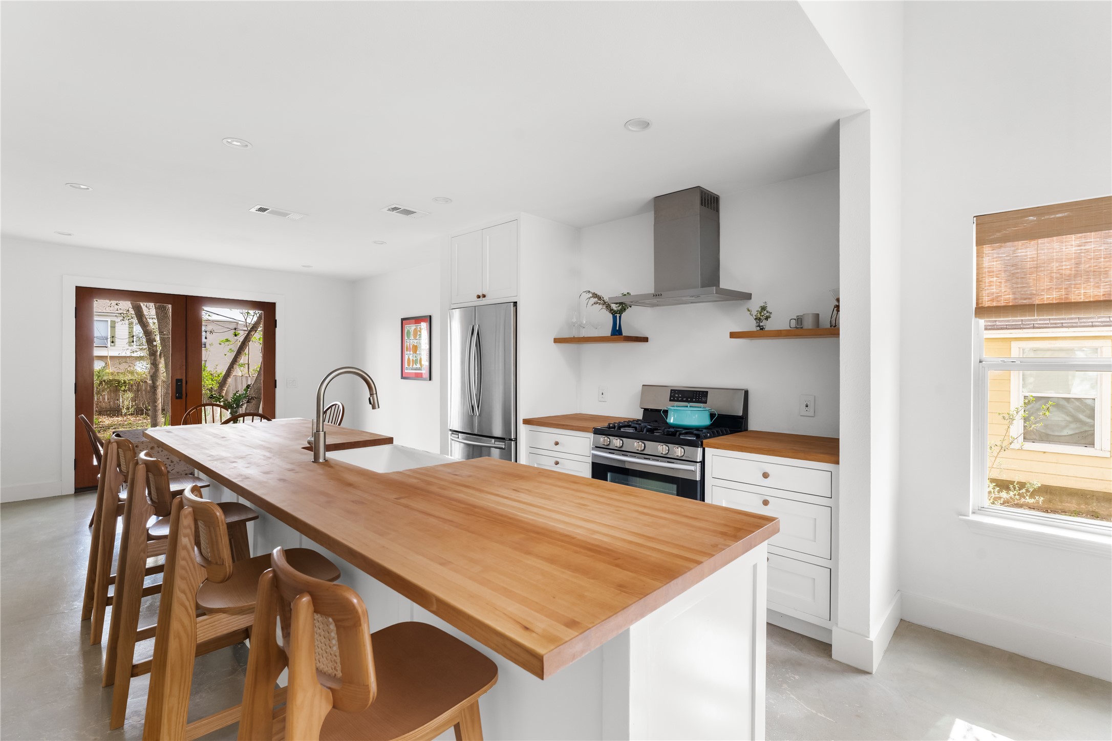 400 Delmar Avenue Austin, TX 78752 - Photo 3 of 36 The kitchen has been fully reimagined with maple butcher block countertops that bring warmth and a durable workspace to the home