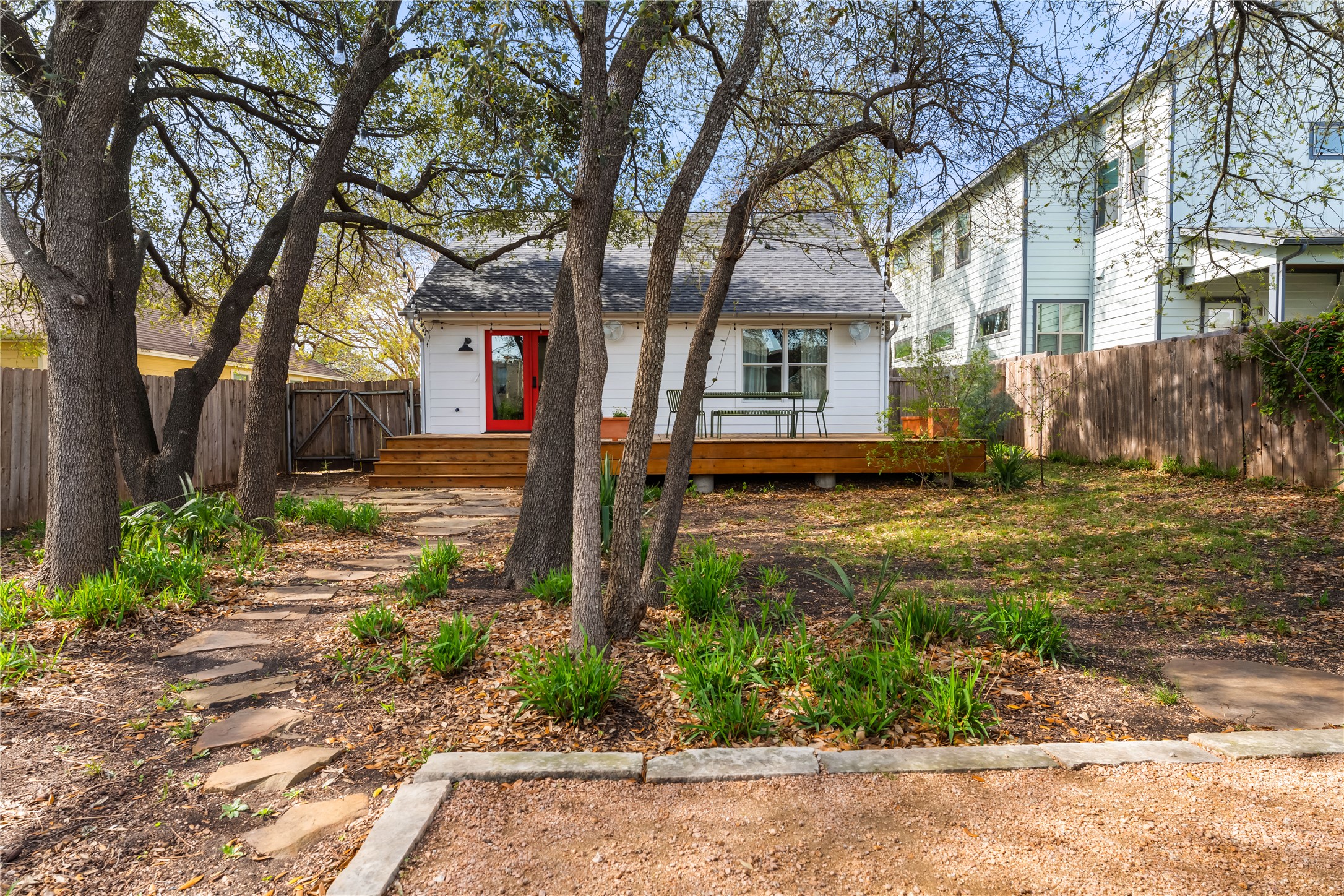 400 Delmar Avenue Austin, TX 78752 - Photo 32 of 36 The backyard is shaded by mature live oaks, keeping the space cooler and comfortable while adding a natural canopy overhead