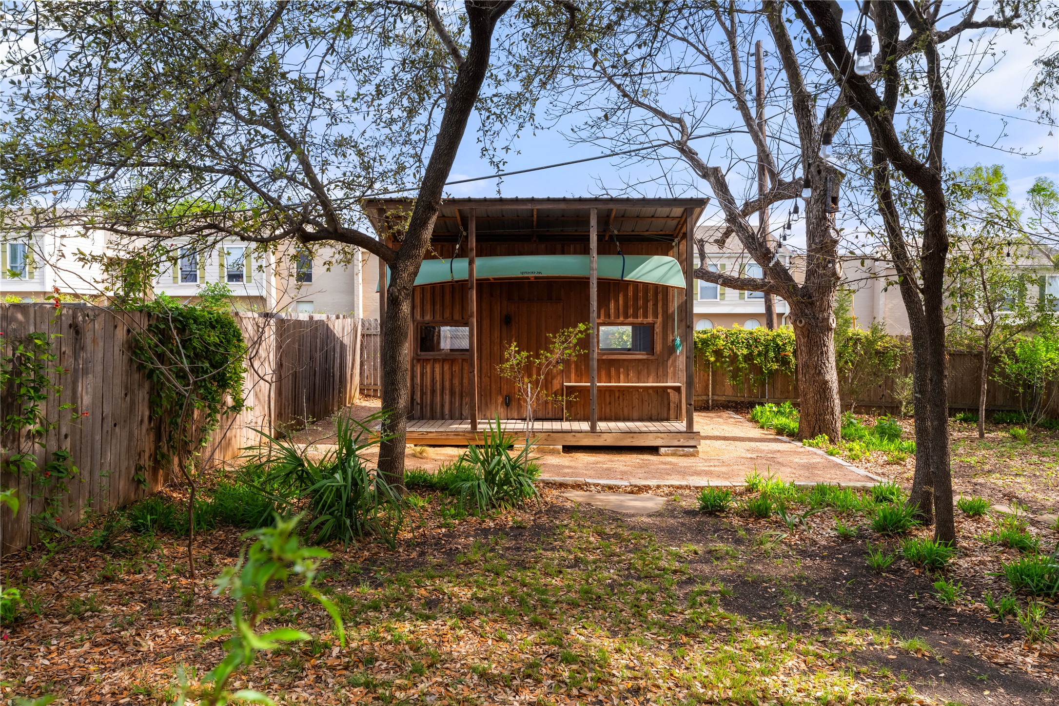 400 Delmar Avenue Austin, TX 78752 - Photo 33 of 36 The custom shed at the back of the property is built with Texas cedar board and batten siding, matching the natural materials used throughout the exterior