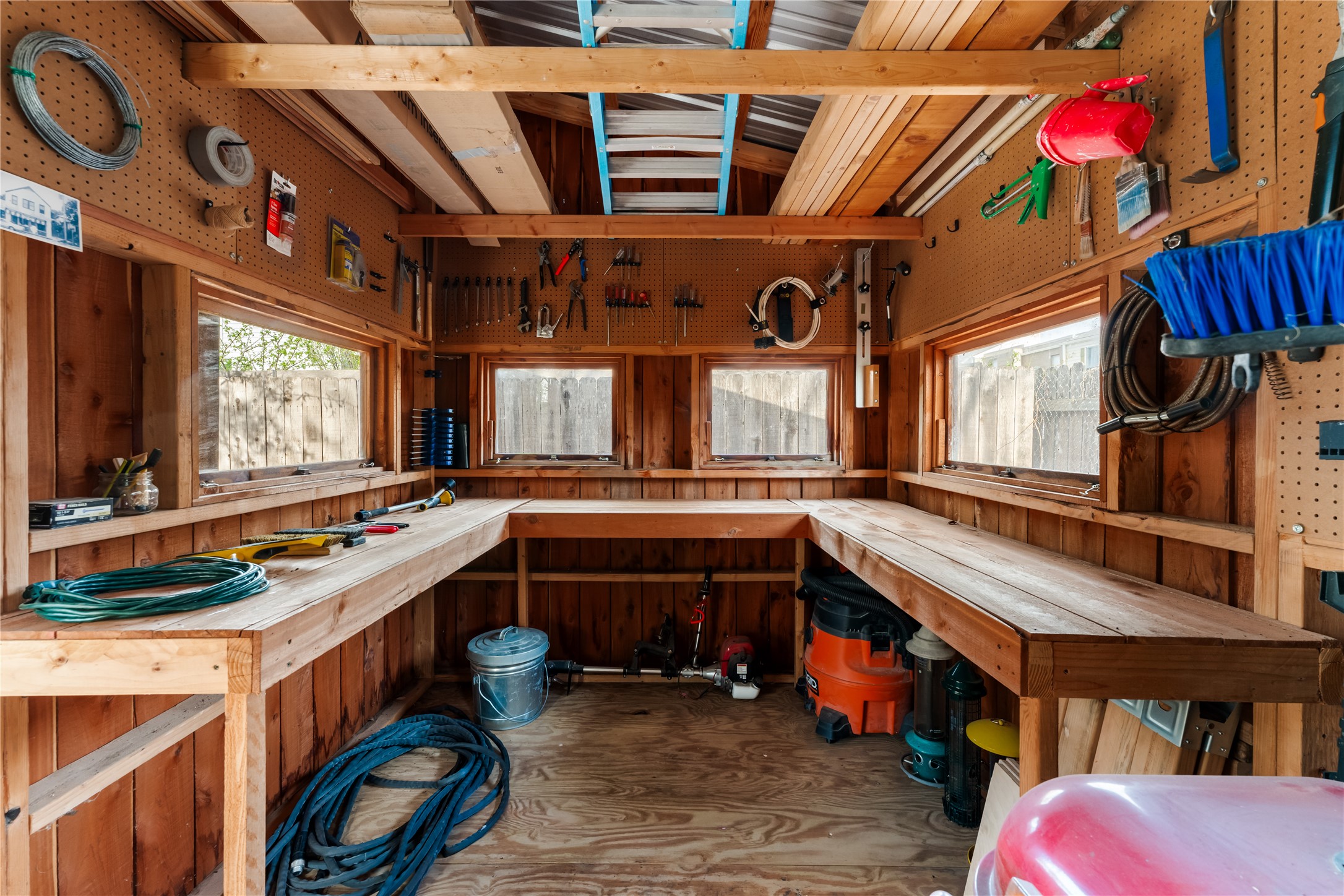 400 Delmar Avenue Austin, TX 78752 - Photo 34 of 36 Set toward the rear of the yard, the workshop creates a dedicated space for tools, equipment, or ongoing projects