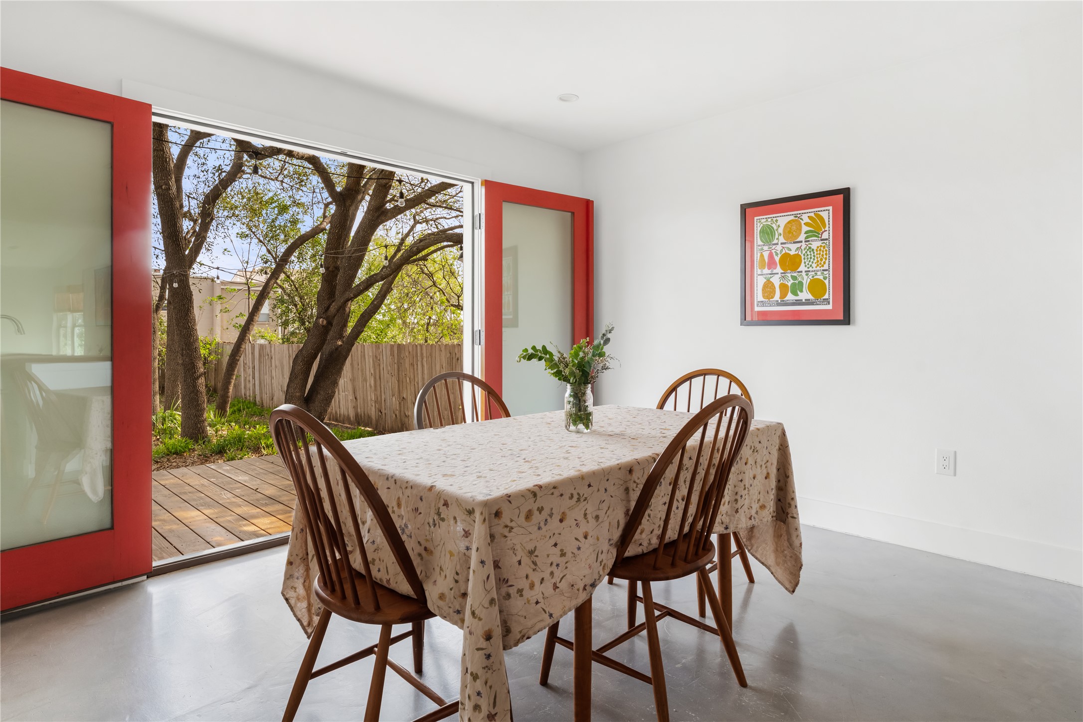 400 Delmar Avenue Austin, TX 78752 - Photo 4 of 36 The dining area sits just off the kitchen and opens directly through french doors to the western red cedar deck