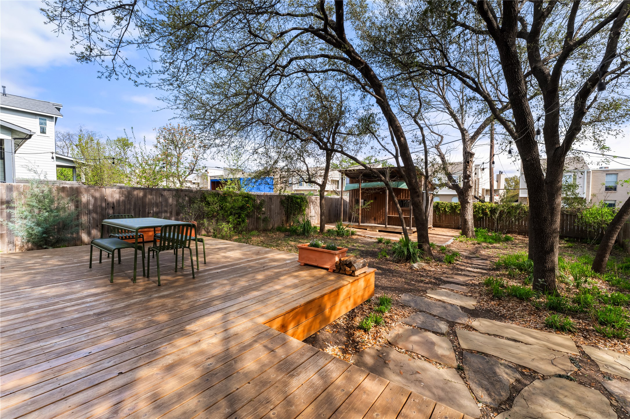 400 Delmar Avenue Austin, TX 78752 - Photo 6 of 36 The Western Red Cedar deck extends directly from the dining area, creating an easy transition between indoor meals and time outside