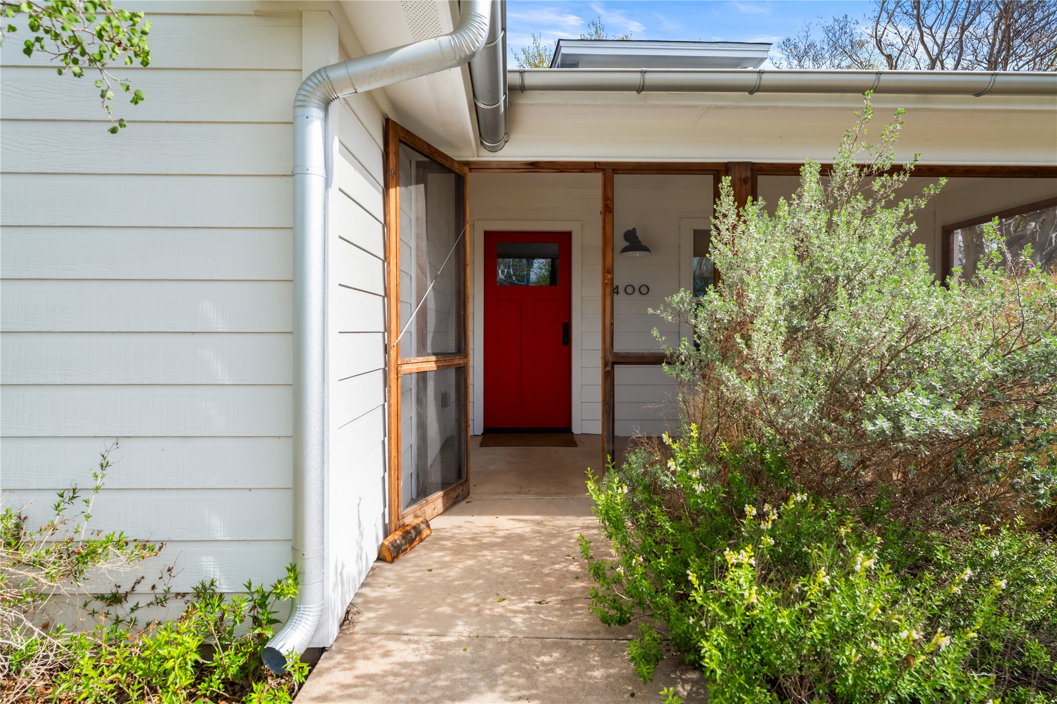 400 Delmar Avenue Austin, TX 78752 - Photo 9 of 36 Thoughtful landscaping frame the home, offering a warm and welcoming first impression