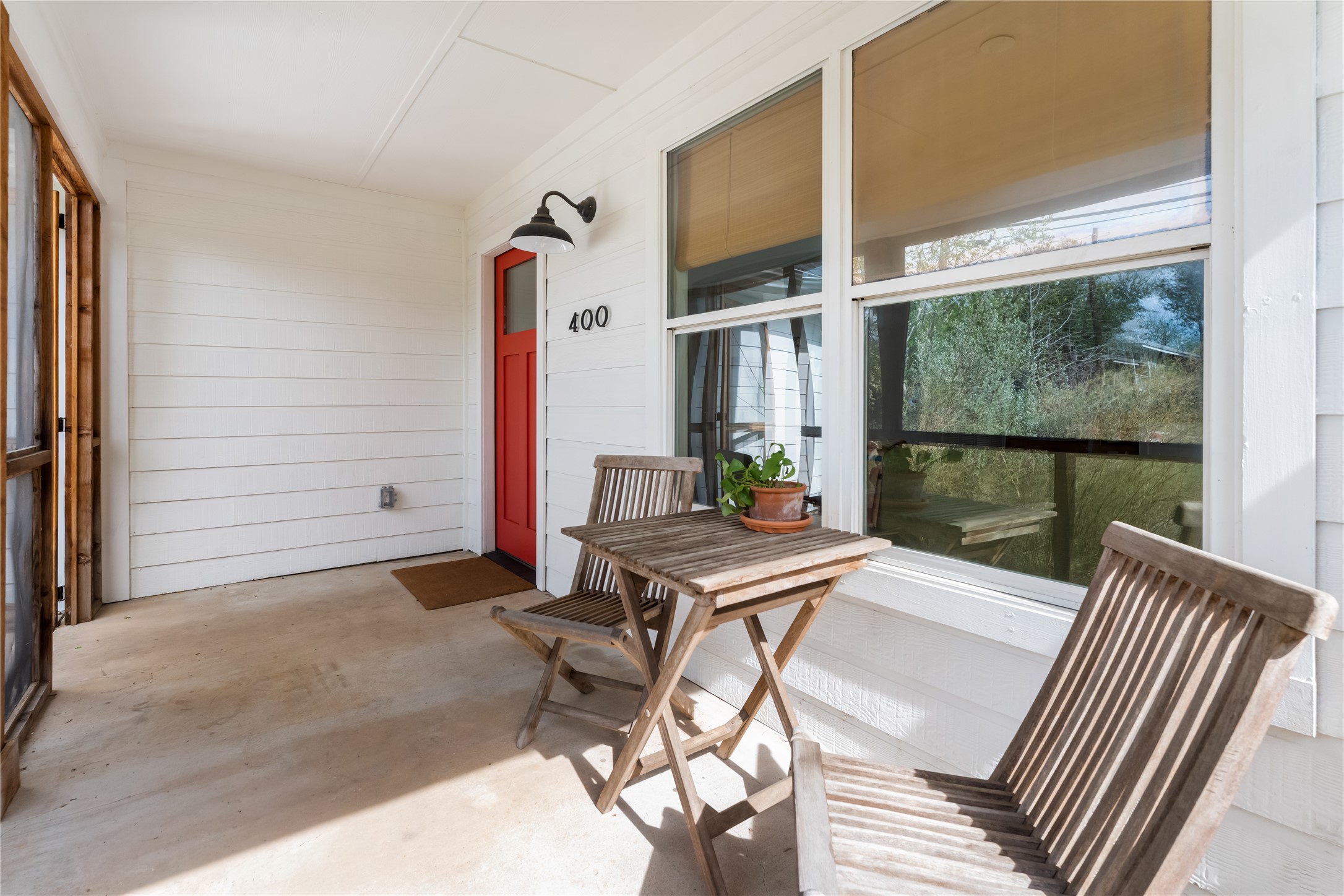 400 Delmar Avenue Austin, TX 78752 - Photo 10 of 36 The screened-in cedar porch sits at the front, offering a shaded, usable space with consistent airflow throughout the day