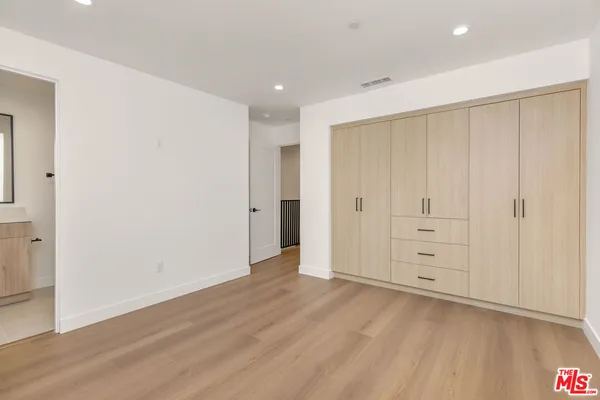 an empty room with wooden floor