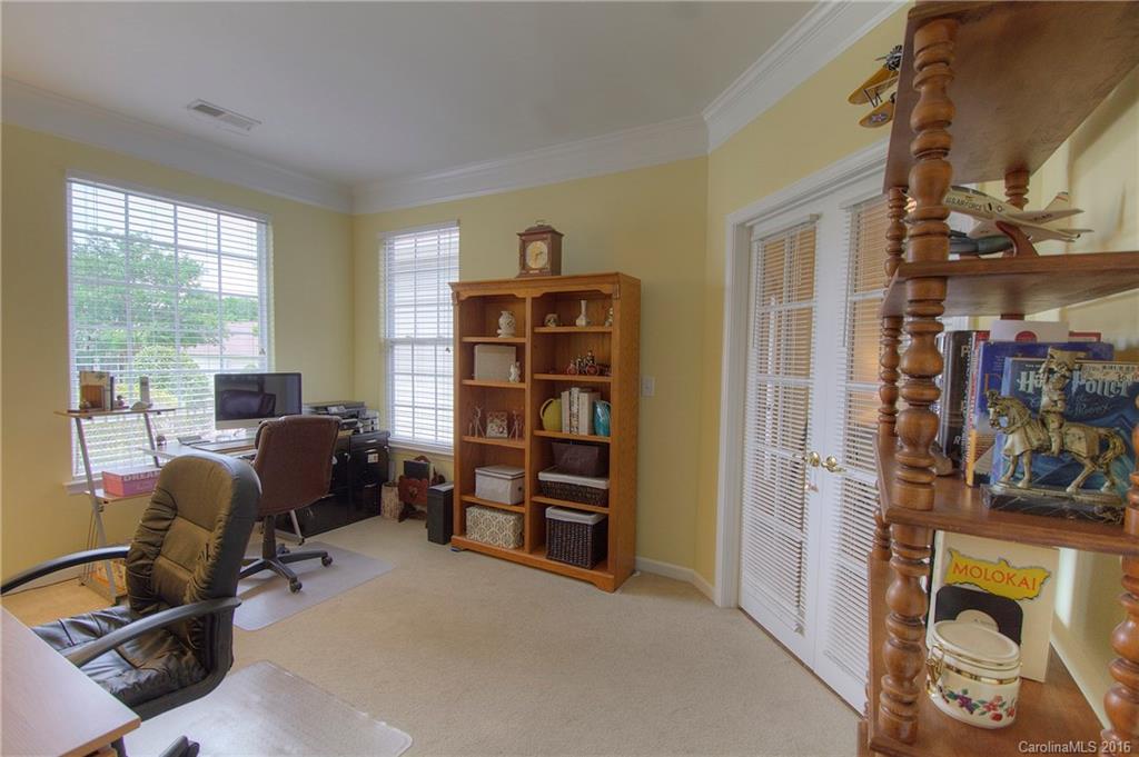 410 Garnet Court Fort Mill, SC 29708 - Photo 3 of 21 a view of a livingroom with workspace and a window