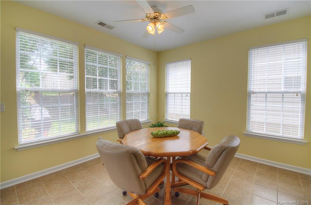 410 Garnet Court Fort Mill, SC 29708 - Photo 8 of 21 a dining room with furniture and windows