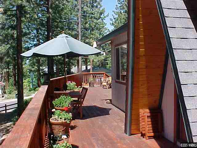 311 Chimney Rock Road Stateline, NV 89449 - Photo 8 of 8 a view of table and chairs under an umbrella