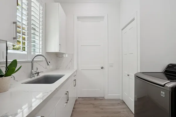 a spacious bedroom with a bed and furniture