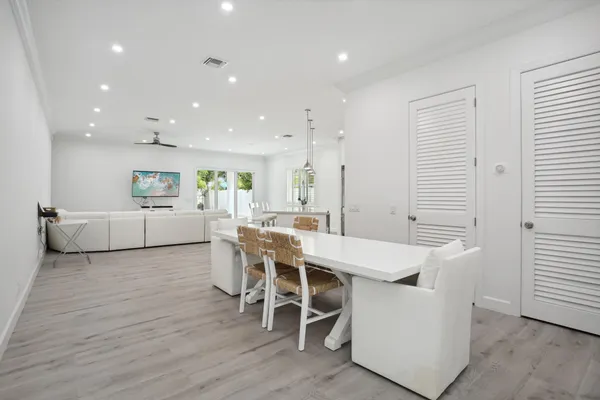 a white bath tub sitting next to a toilet