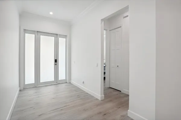a living room with kitchen island furniture and a wooden floor