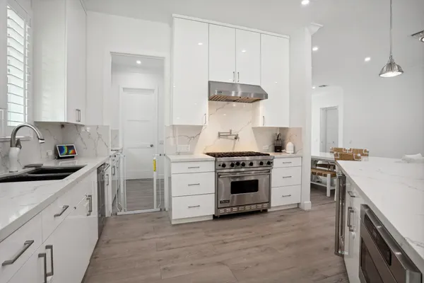 a bedroom with a bed and a wooden floor
